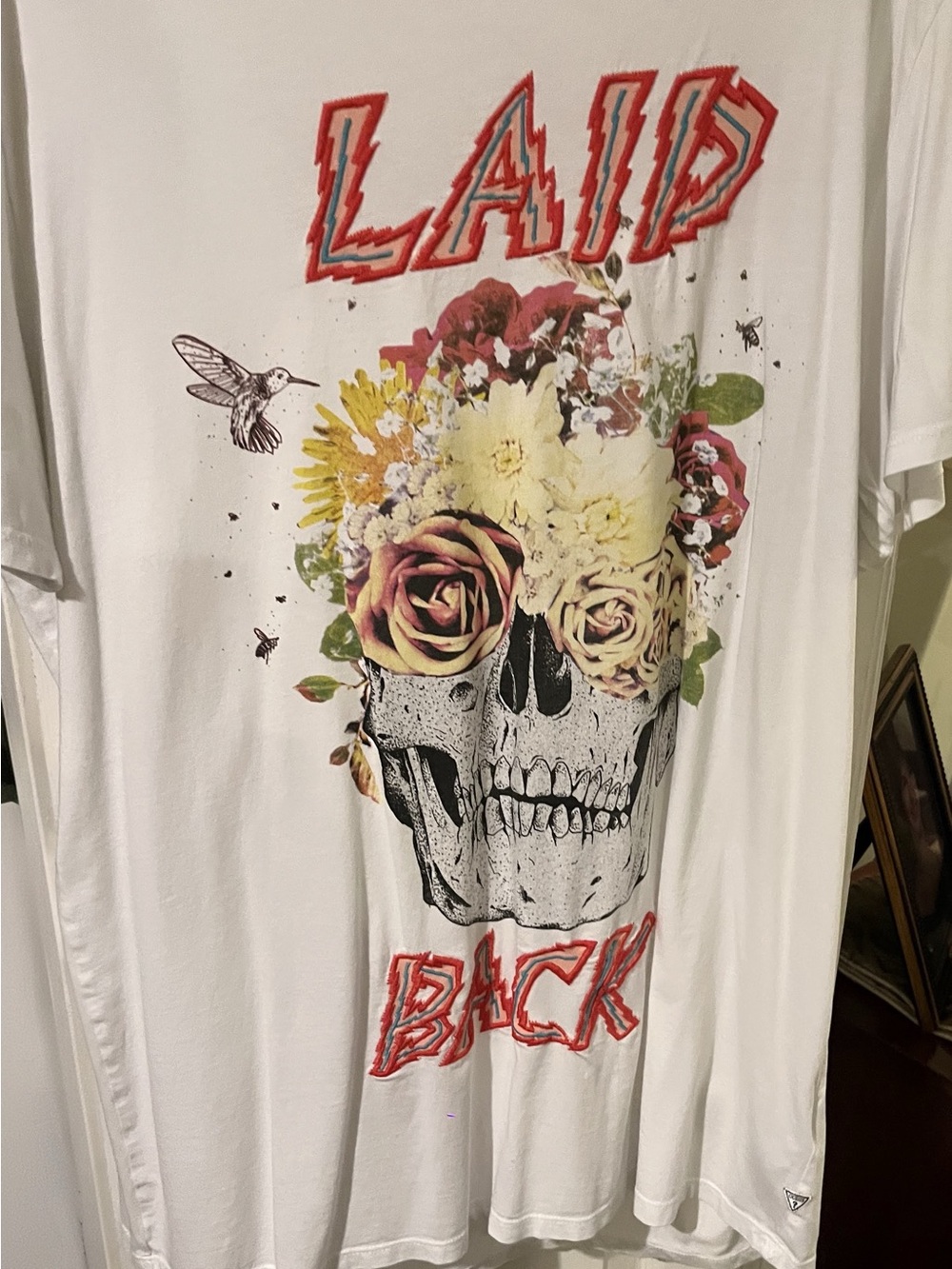 Guess White Graphic Tee with Floral Skull and Red Lettering